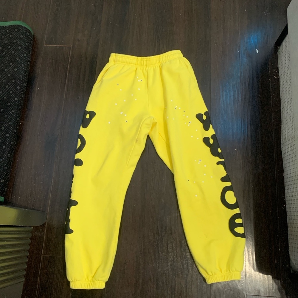 Sp5der sweatpants gold and black size small fits baggy with 2 bottom small stain